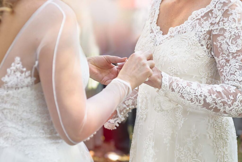 Brides sharing vows at their wedding